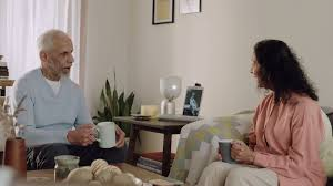 Two people talking with tech