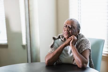 Older woman sitting alone