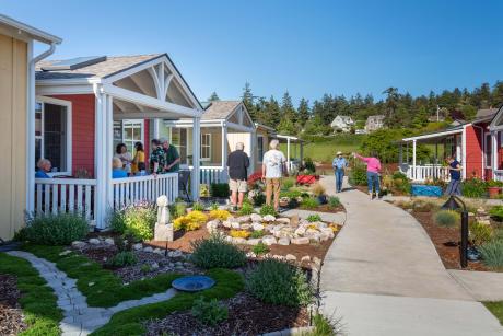 Quimper Village residents gather one of the lanes between houses (pre pandemic). Photo courtesy of Durrett Architects