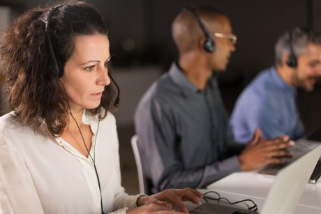 Woman at phone crisis line talking with someone