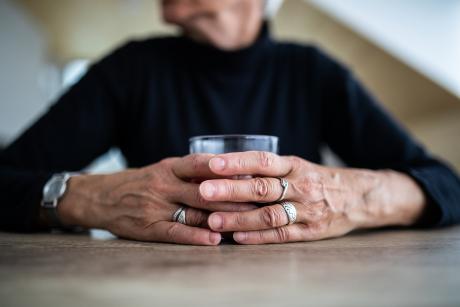 Older woman having a drink