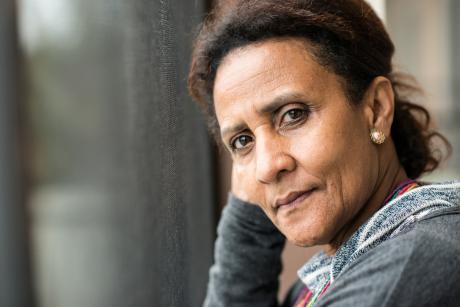 Pensive woman looking at the camera