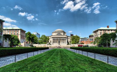 New York City, New York, USA - August 1, 2010: The Low Memorial Library at New York City's Columbia University framed by bare trees of winter on a sunny day.