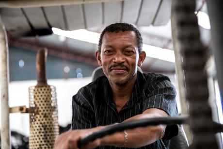 Older worker driving a forklift