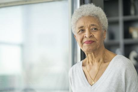 older woman smiles at camera