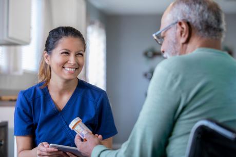 Nurse talking to older patient