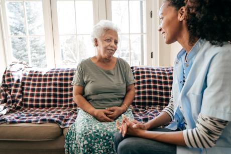 older woman talking to a care manager