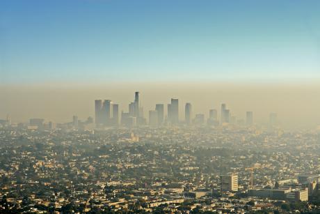 Wide shot of the downtown Los Angeles skyline bathed in smog