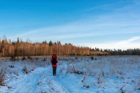 Woman walking in snow red jacket