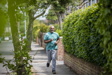 Man runs in nice neighborhood