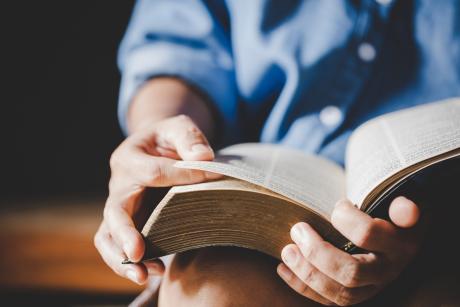Person reading religious text