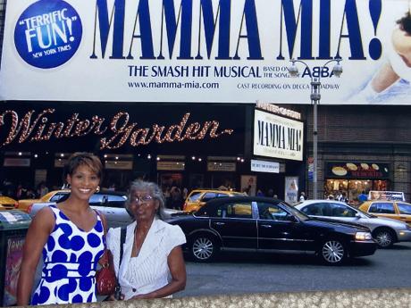 Julia Y and her mom in front of Mamma Mia! sign