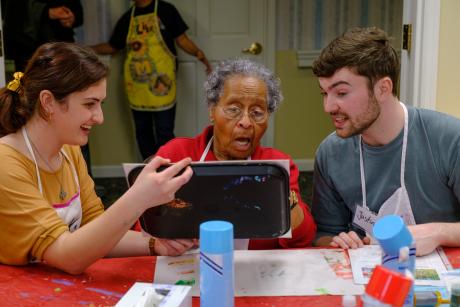 Miami University students work with a resident at Knolls of Oxford in the OMA progam