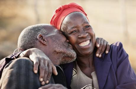 Happy older couple embraces