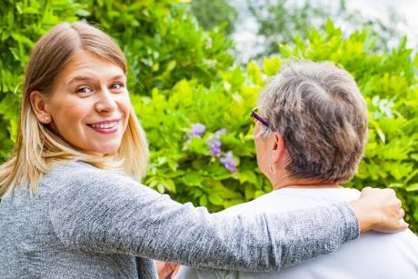 Young woman takes care of her mom