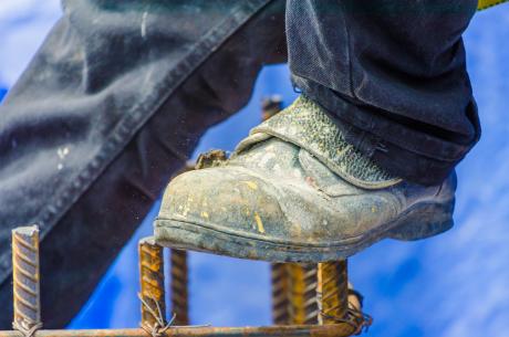 Construction worker lower legs only