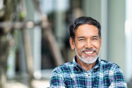Older Asian man happy