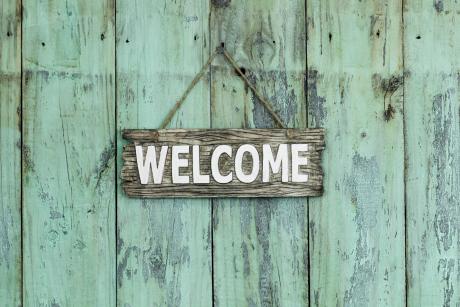 Weathered wood with welcome sign
